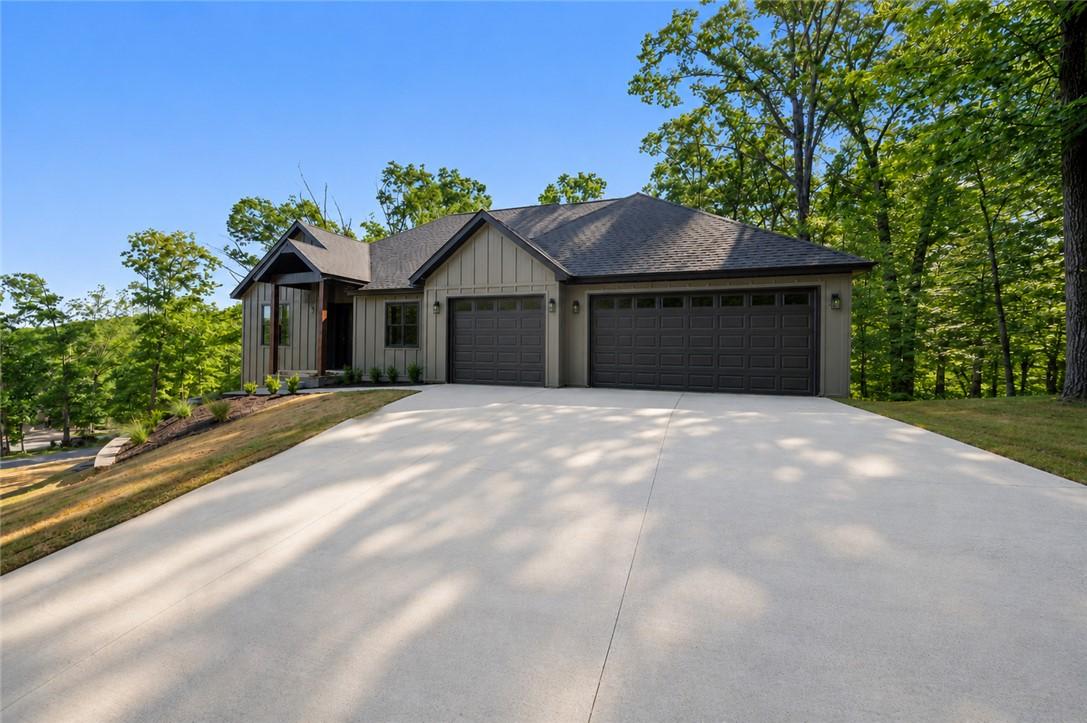 Image 2: Modern home exterior featuring vertical board-and-