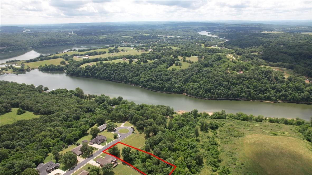 Image 1: Aerial perspective showcasing a property outlined