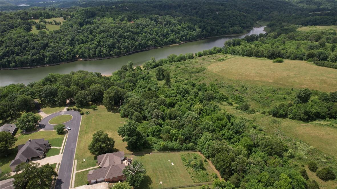 Image 3: Expansive aerial perspective showcasing a river bo