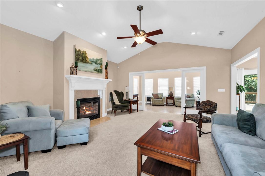 Image 2: Living area featuring a floor-to-ceiling fireplace