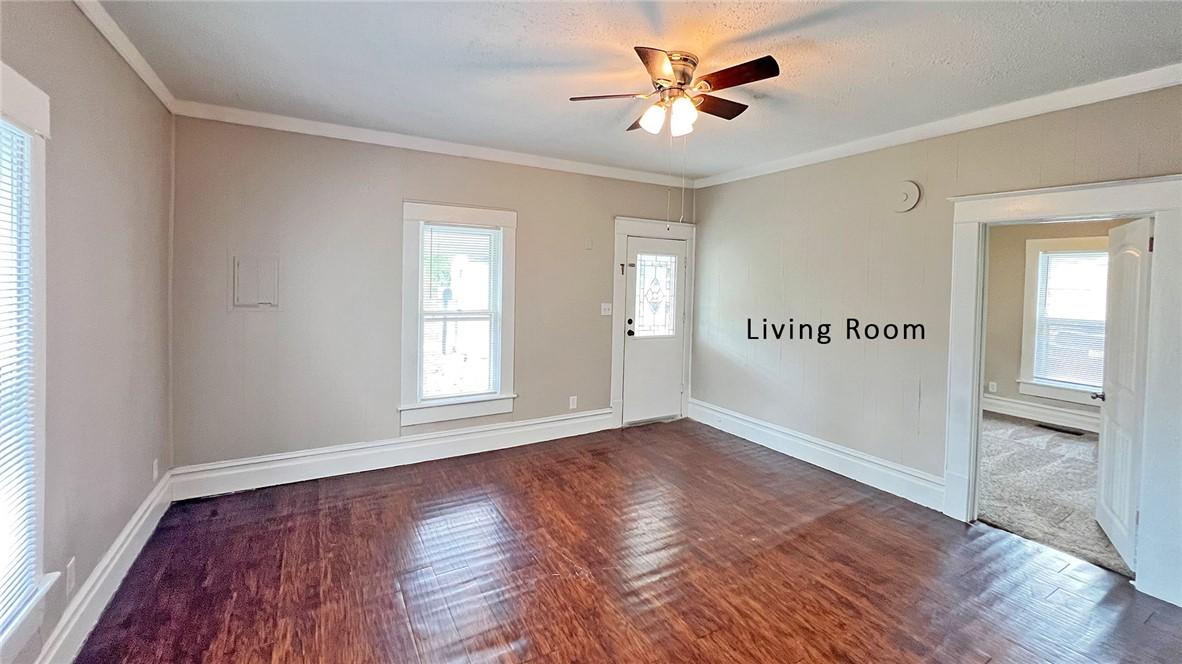 Image 2: Living Room view toward the front door.