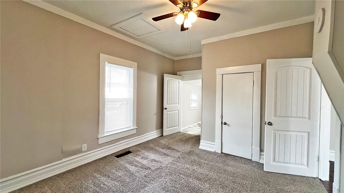 Image 4: Carpeted room featuring a ceiling fan with integra