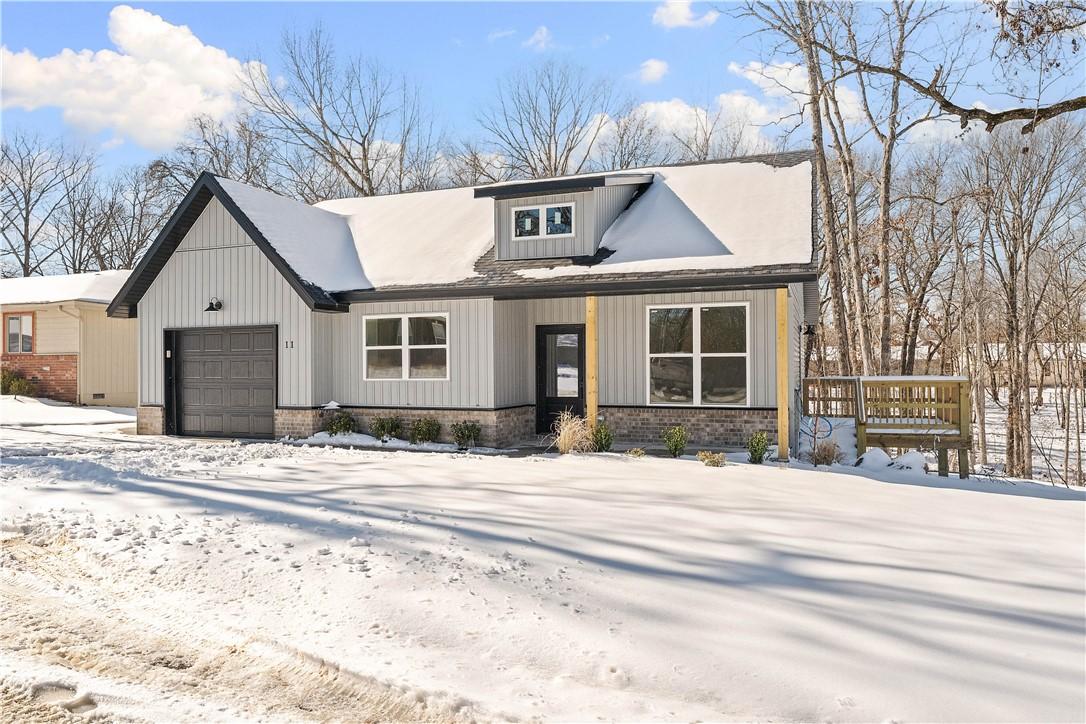 Image 3: Modern inspired farmhouse featuring an attached ga