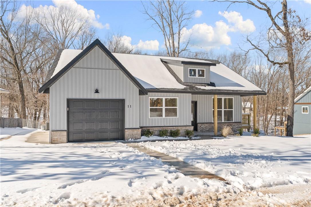 Image 4: View of front of home with covered porch and an at