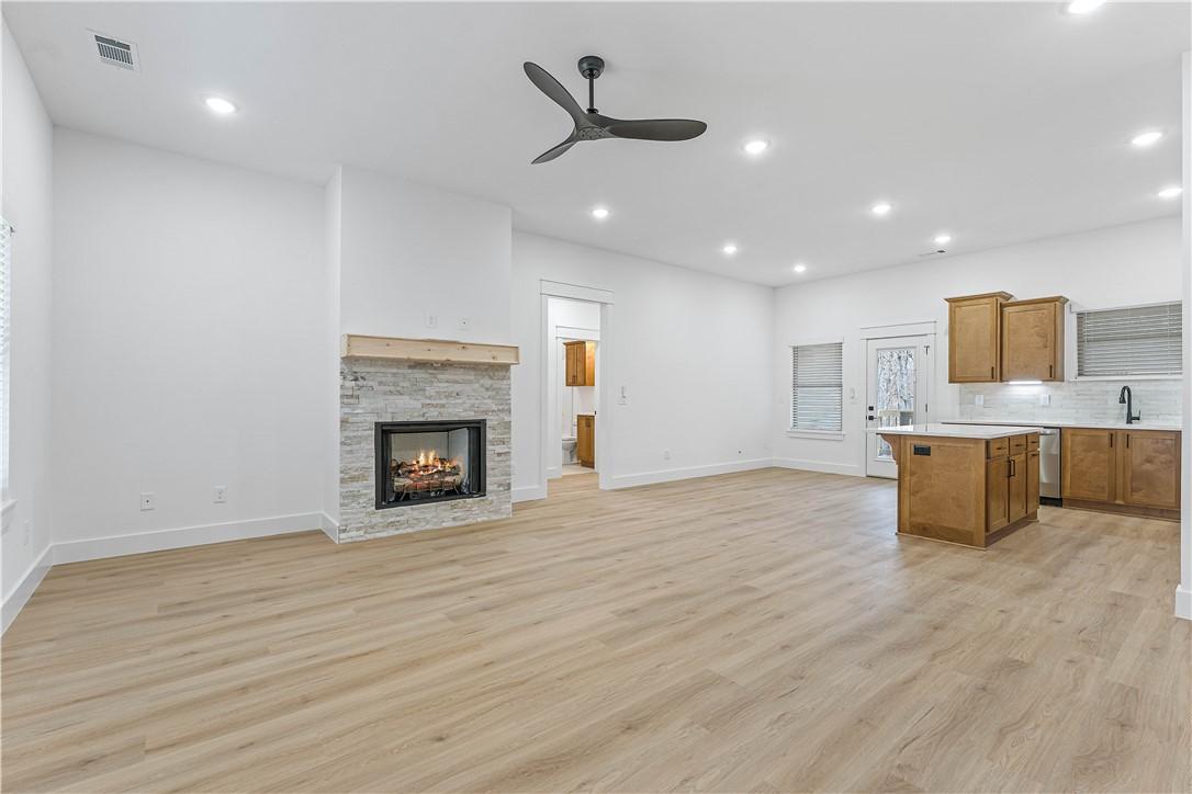 Image 3: Unfurnished living room featuring a ceiling fan, l