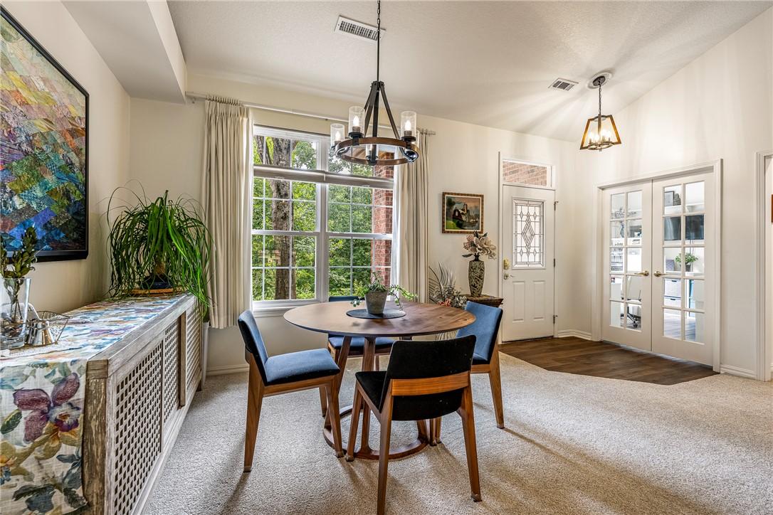 Image 2: High ceilings and new fixtures adorn the dining ar