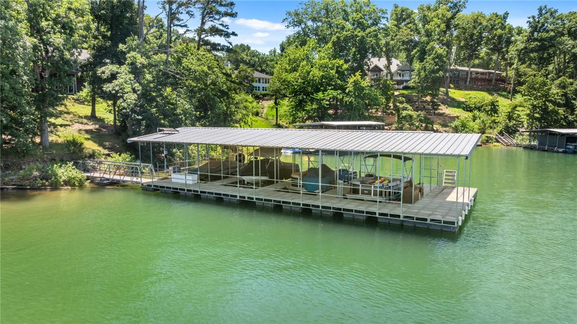 Image 1: Covered co-owned 4 stall boat dock with Swim Platf