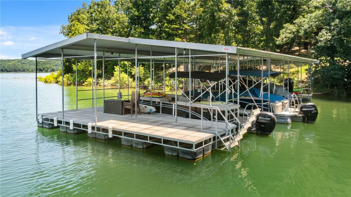 Image 2: Covered co-owned 4 stall boat dock with Swim platf