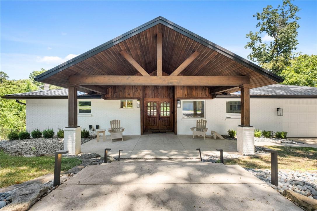 Image 4: Front  Covered Porch with exposed wood beams and w