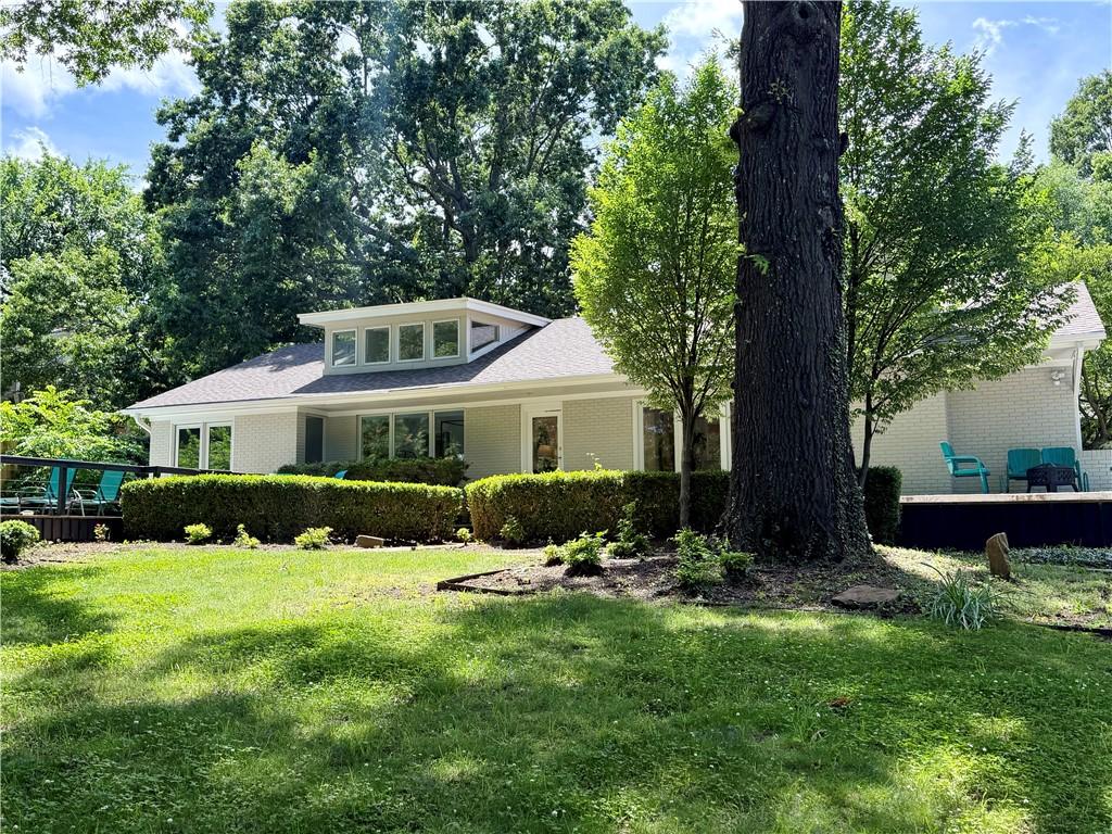 Image 2: The street view of this hallmark Fayetteville home