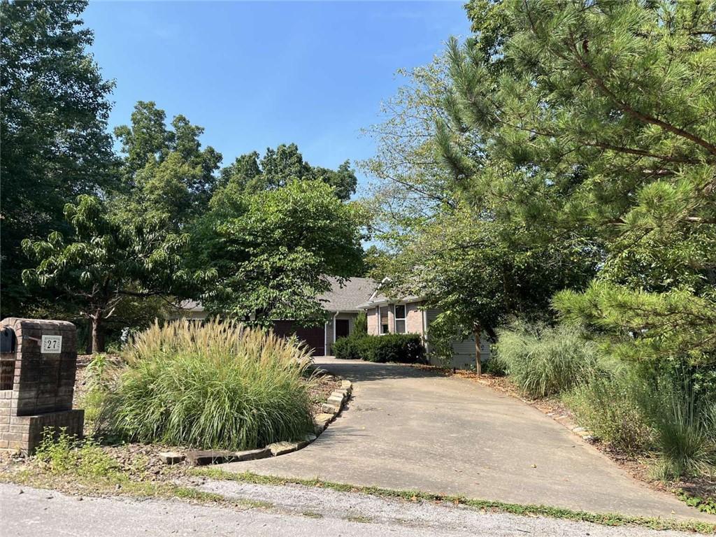 Image 2: View of property hidden behind natural elements fe