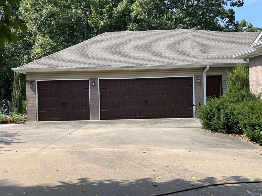 Image 3: Garage featuring driveway