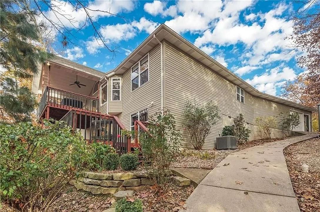 Image 4: View of property exterior featuring ceiling fan, a