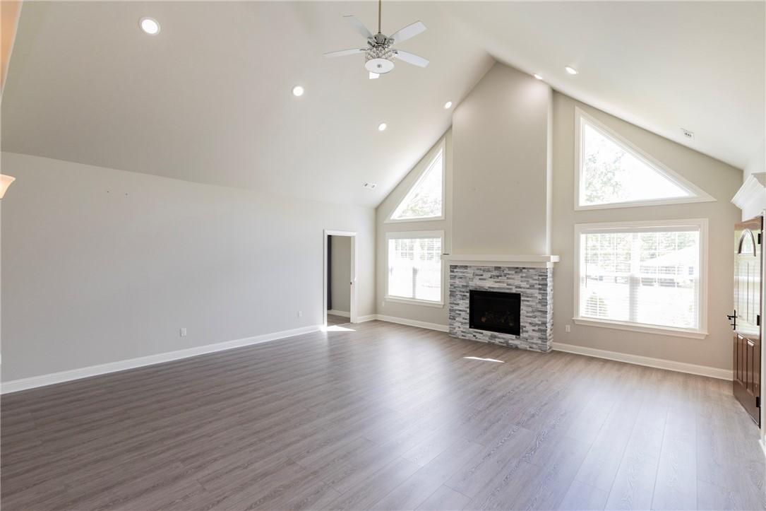 Image 3: Great room featuring a vaulted ceiling with recess