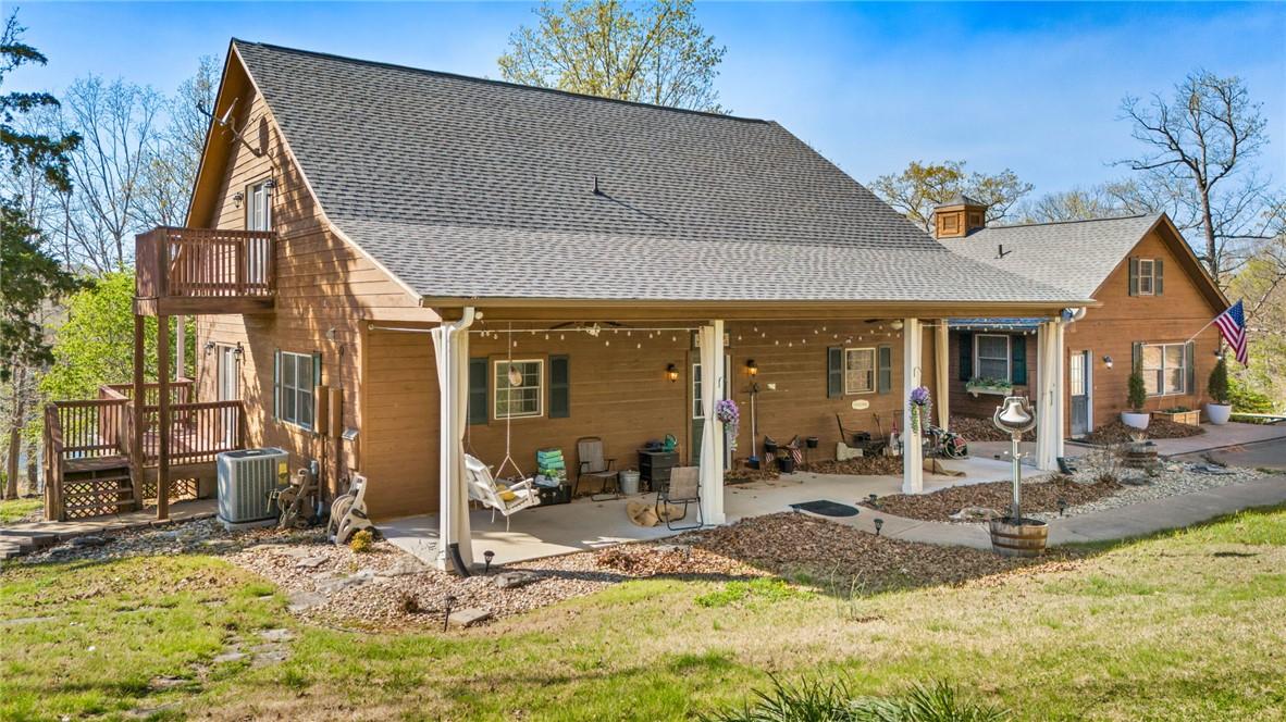 Image 4: Back porch comes equipped with porch swing and ham