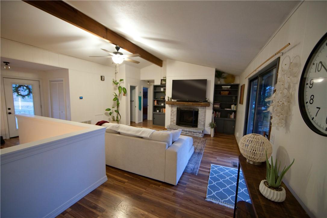 Image 2: Living room with Newer LVP floors, cozy FP, New Fu