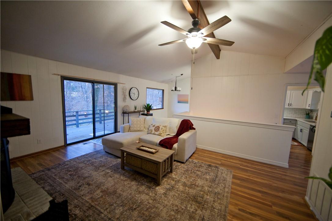 Image 4: Nice sized living room with cozy fireplace and vau