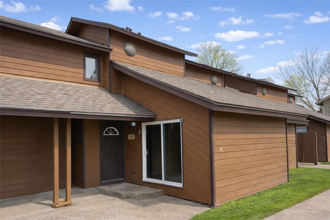 Image 1: Rear view of property with roof with shingles