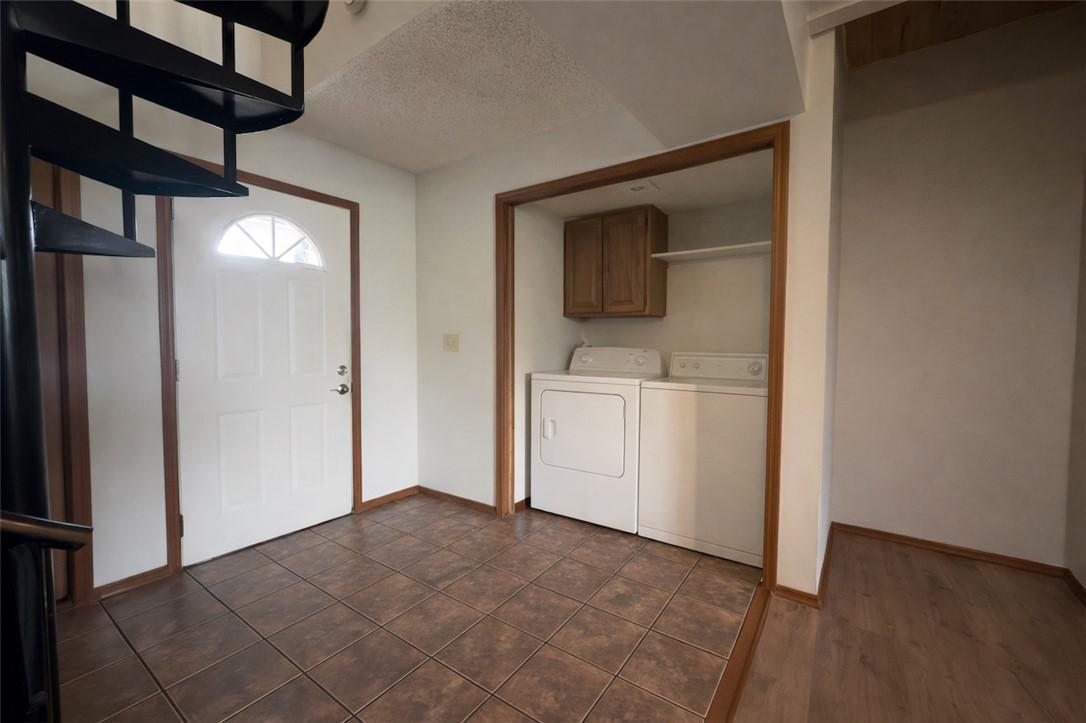 Image 3: Laundry room featuring a textured ceiling, washing