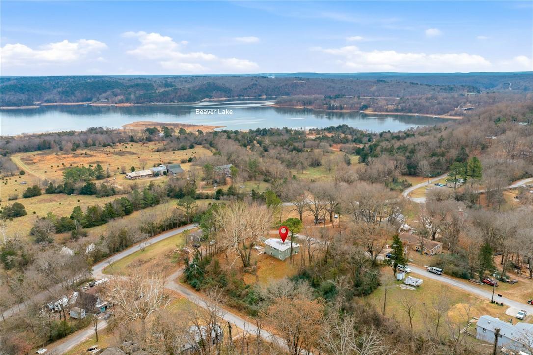 Image 1: Aerial view of property's location with a large bo