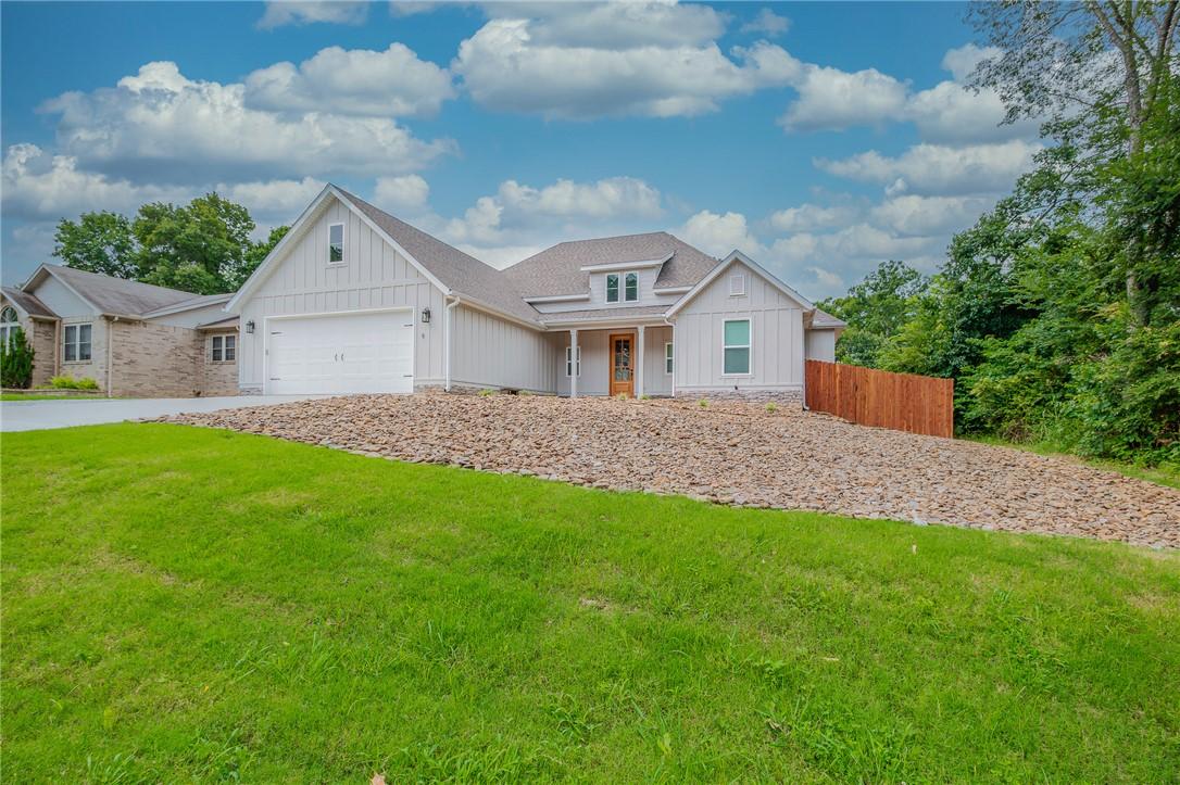 Image 1: Modern farmhouse-inspired exterior featuring verti