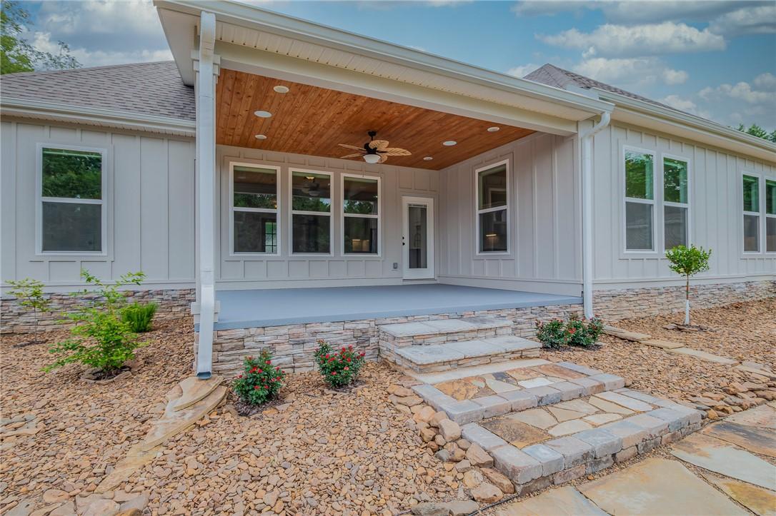 Image 2: Covered patio with a wood-plank ceiling, recessed