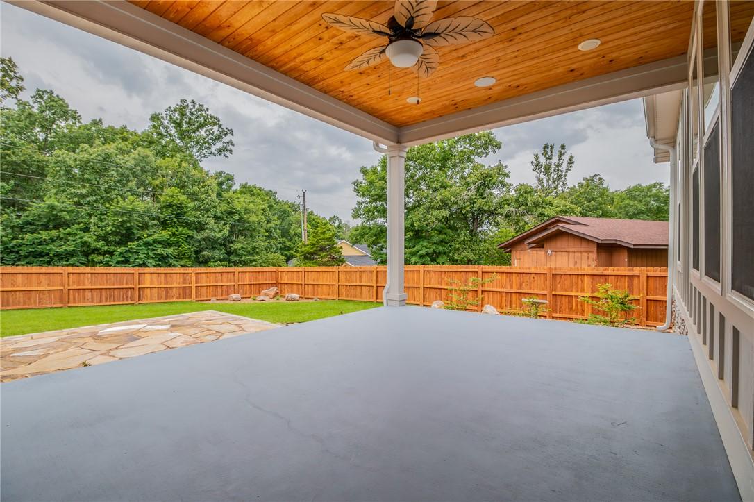 Image 4: Covered patio featuring a wood-finish ceiling with