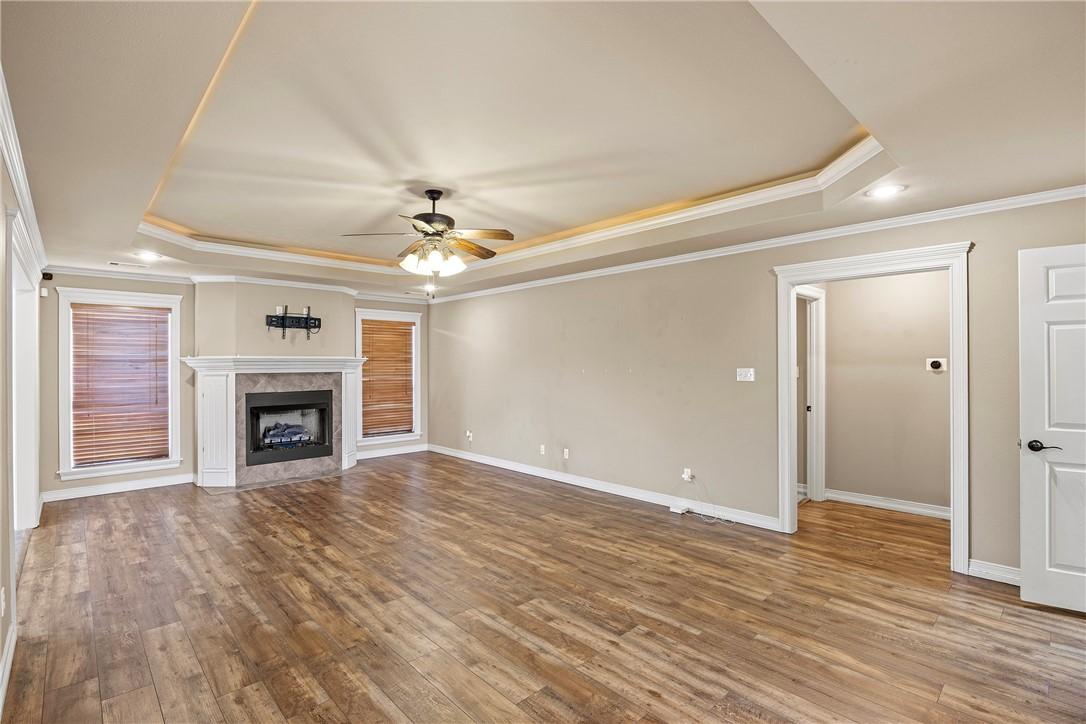 Image 4: Unfurnished living room featuring a raised ceiling
