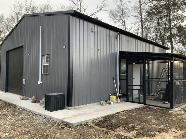 Image 1: 30x50x12 Steel building with insulated garage door