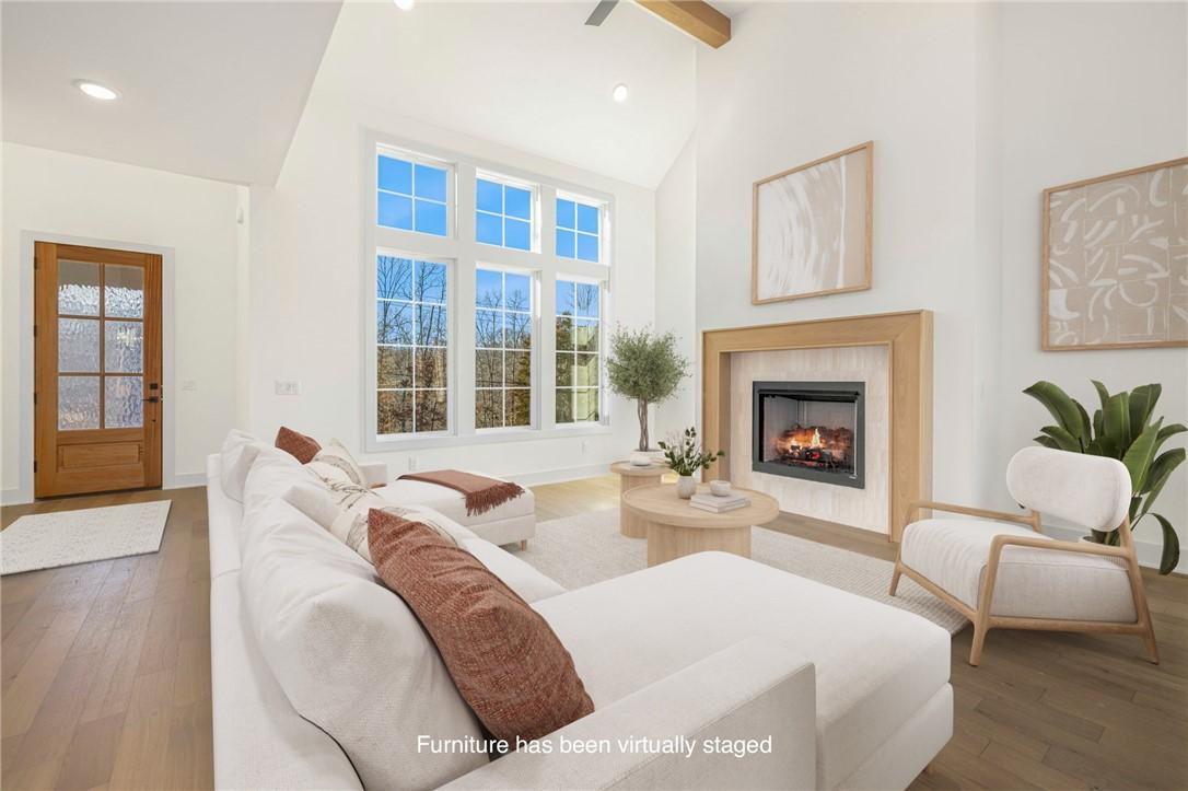 Image 3: Living room with hardwood / wood-style floors, a h