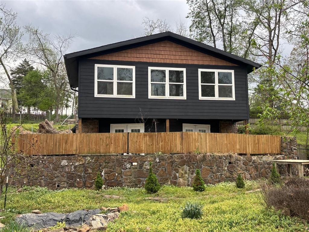 Image 1: The property features a dark-toned exterior with l