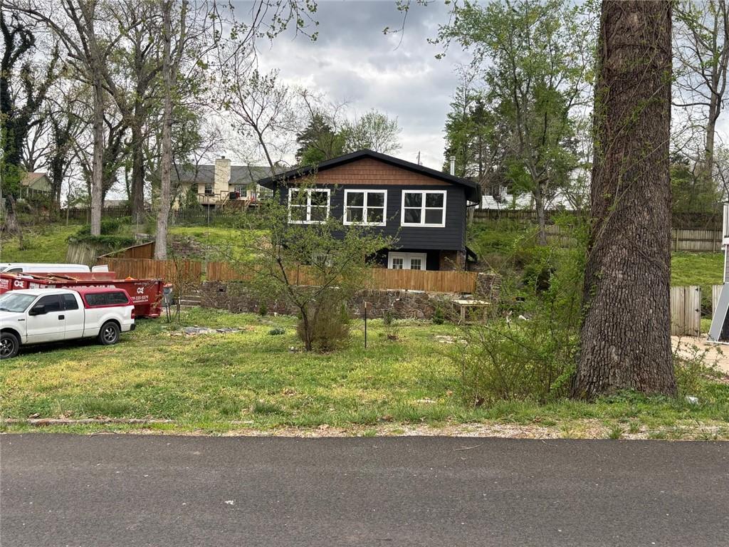 Image 2: The property features a dark exterior with white-f