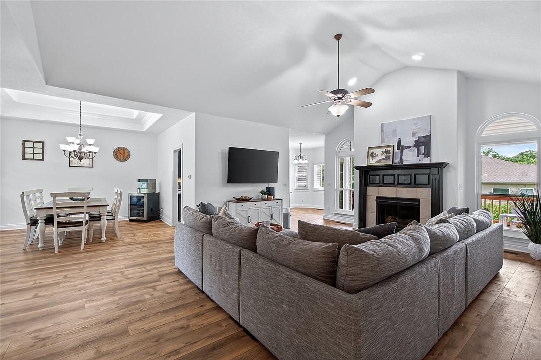 Image 3: Spacious living room with gas fireplace and new wi