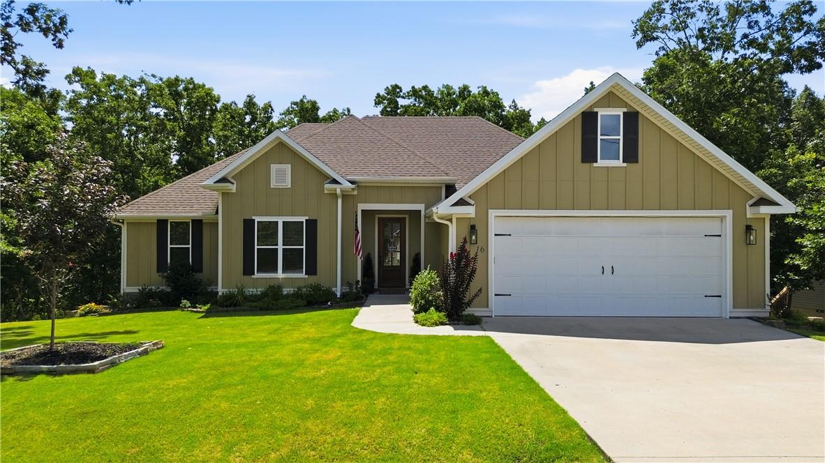 Image 2: Modern ranch-style home featuring a two-car garage