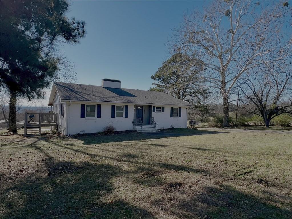 Image 1: View of front of property featuring a large front