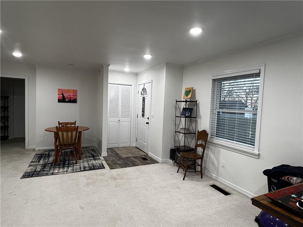 Image 4: Tiled foyer with coat closet, recessed lighting an