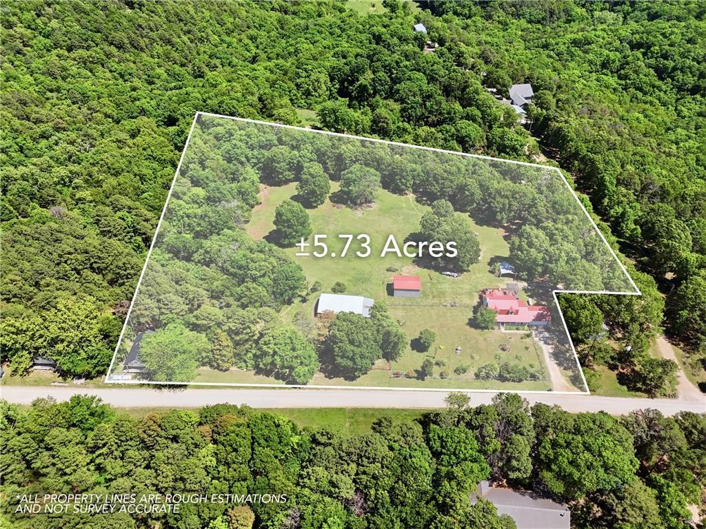 Image 2: Expansive 5.73-acre lot featuring a main residence