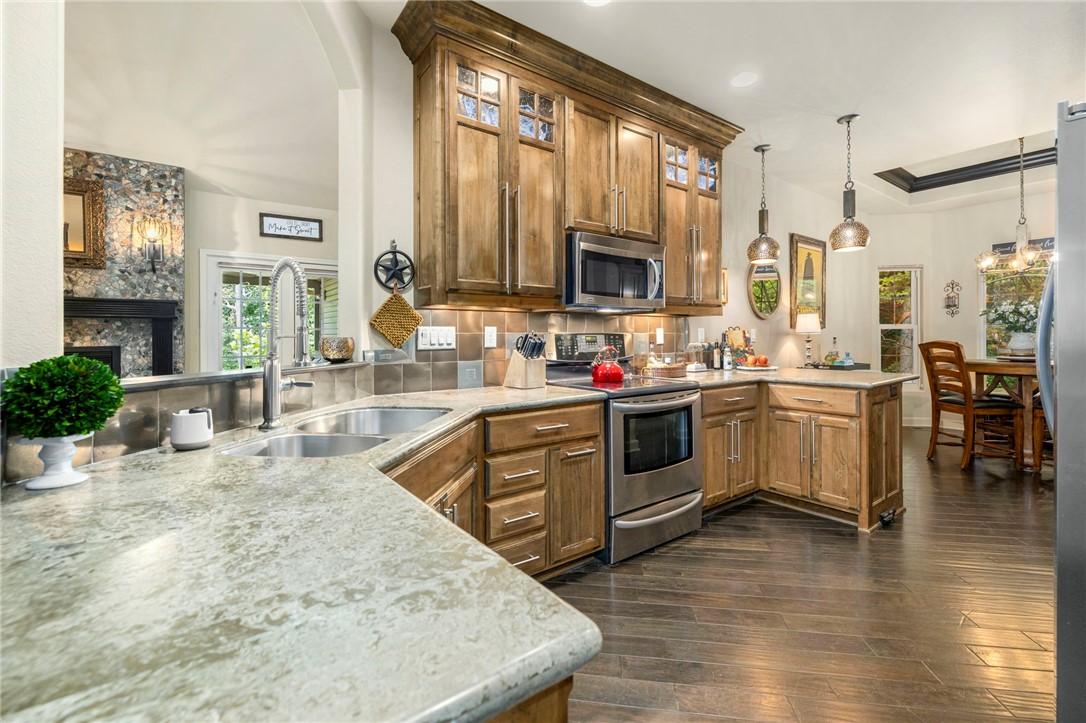 Image 4: The kitchen offers functionality and warm tones.