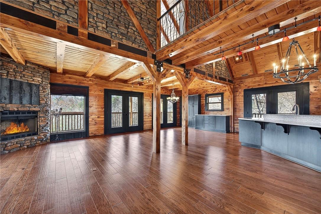 Image 2: Main level living area with vaulted and wooden bea