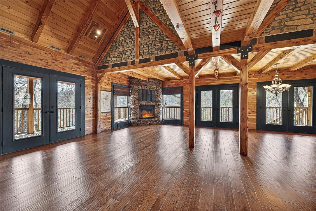 Image 3: Main level living area with vaulted and wooden bea