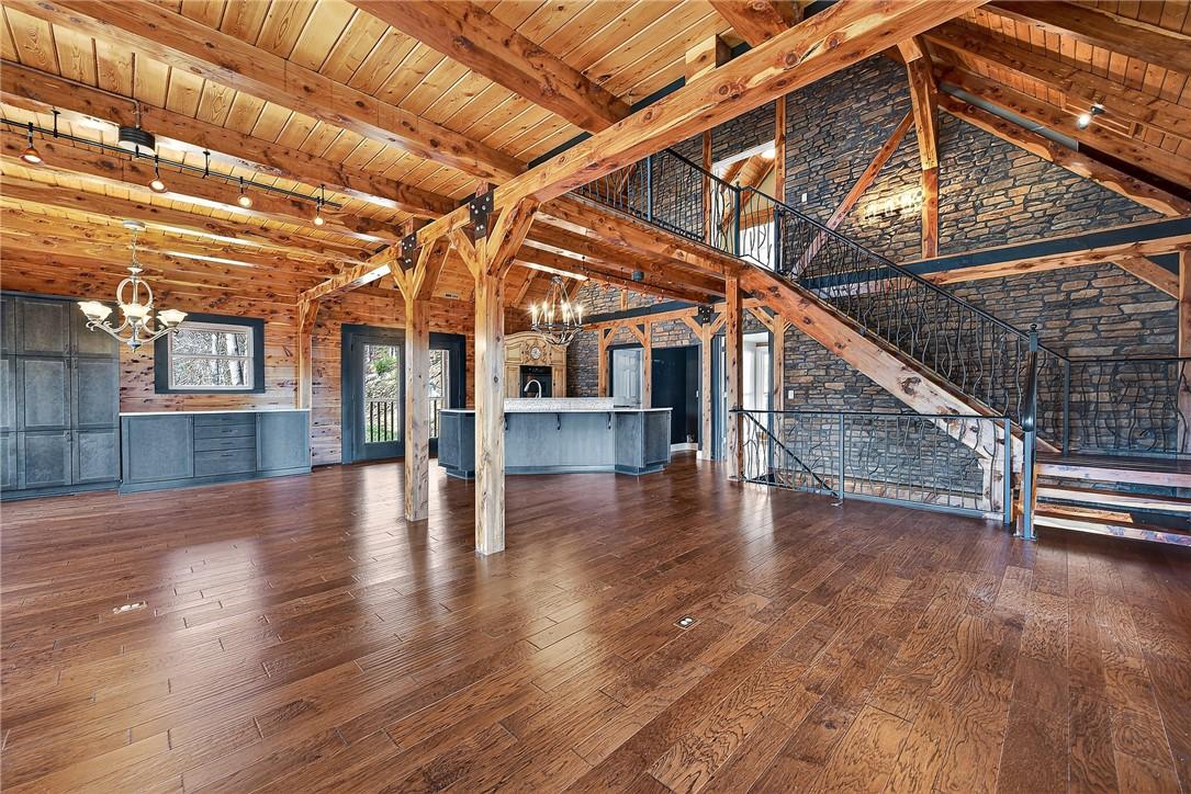 Image 4: Main level living area with vaulted and wooden bea