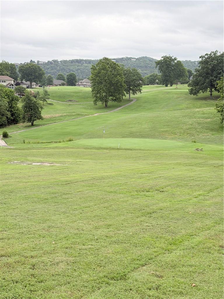 Image 1: Expansive golf course setting featuring a manicure