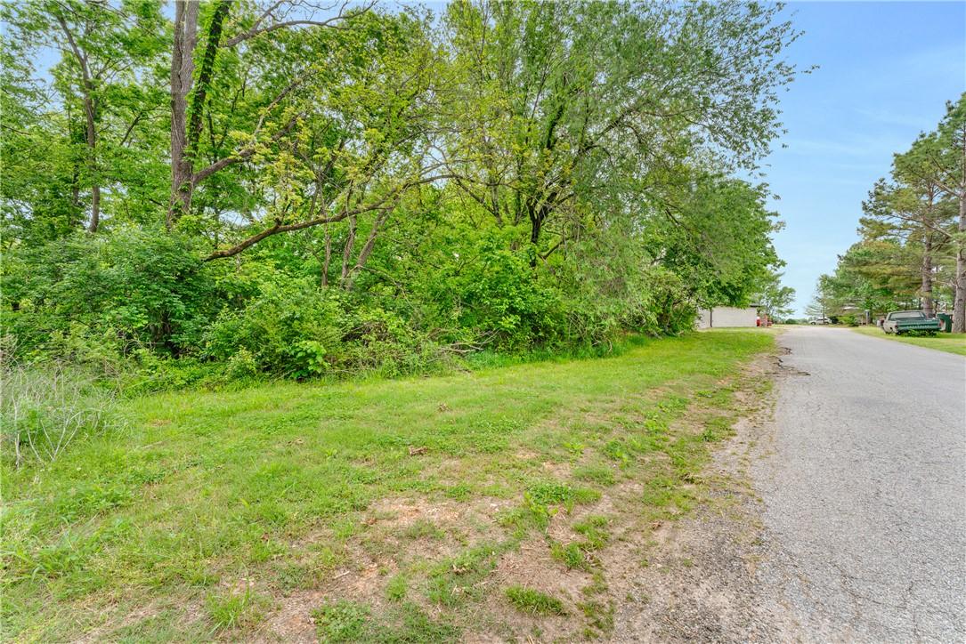 Image 3: Grassed lot featuring mature trees and lush vegeta