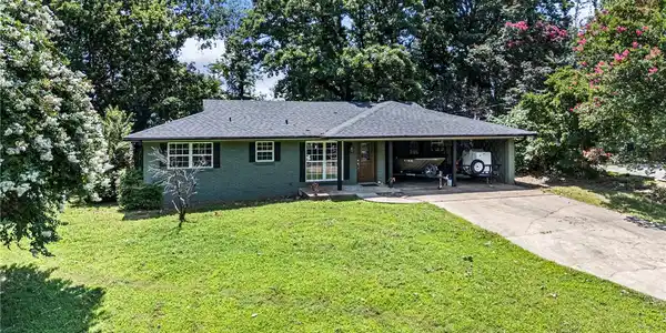 Image 3: Ranch-style residence featuring a dark grey shingl