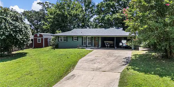 Image 4: Single-story residence featuring a covered carport
