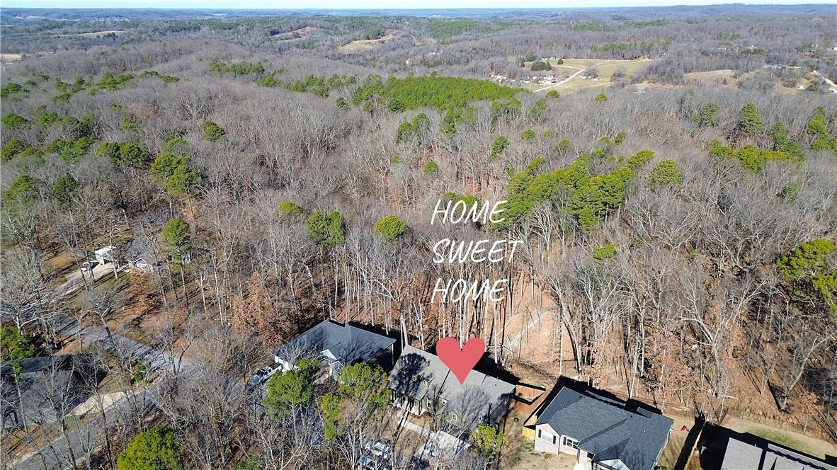 Image 3: View of property location featuring a heavily wood