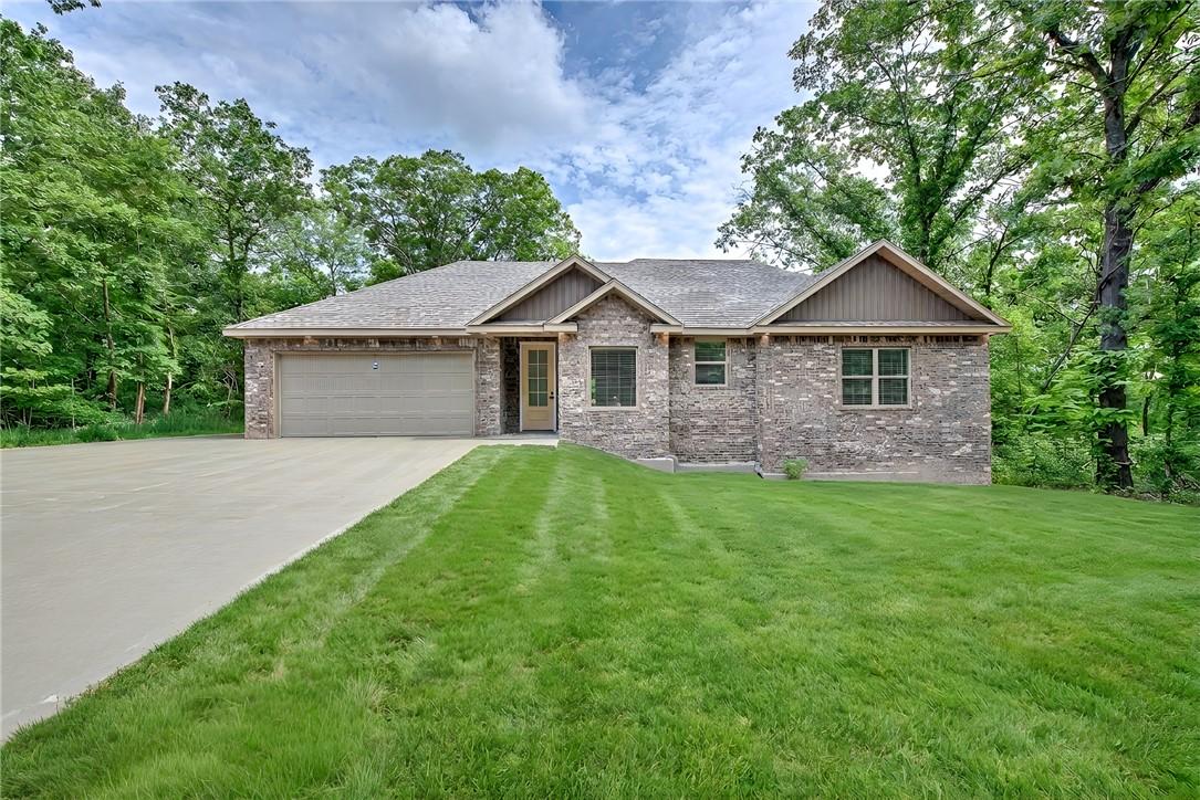 Image 2: Brick exterior with gabled roof lines, featuring a
