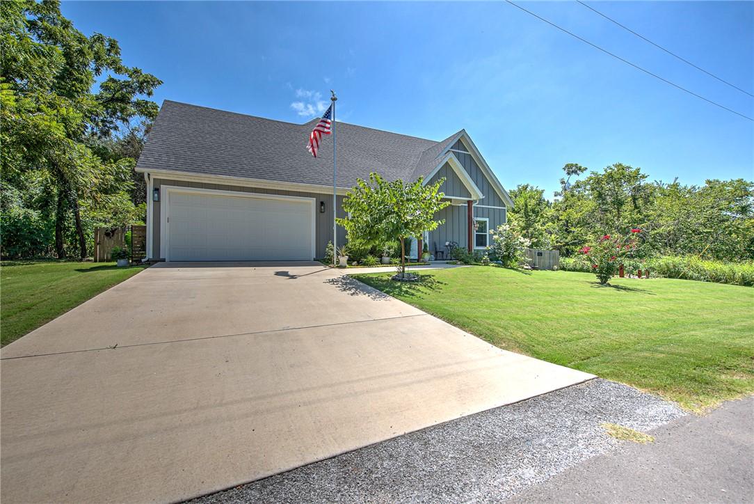 Image 4: Contemporary residence featuring a dark gray roof,