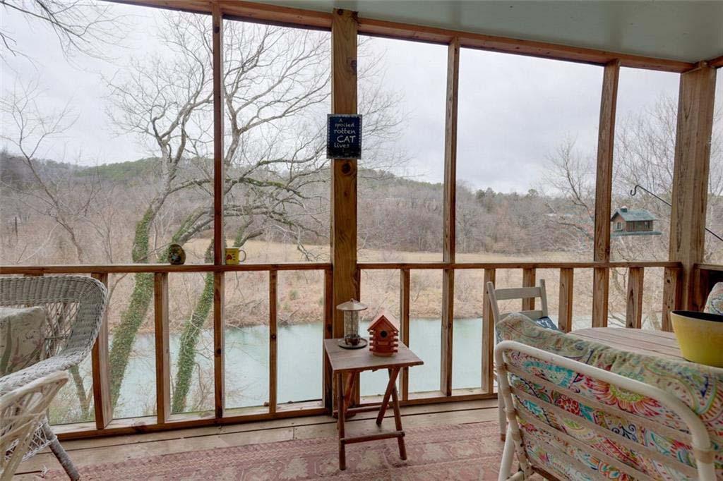 Image 1: Screened porch featuring wood-frame construction a