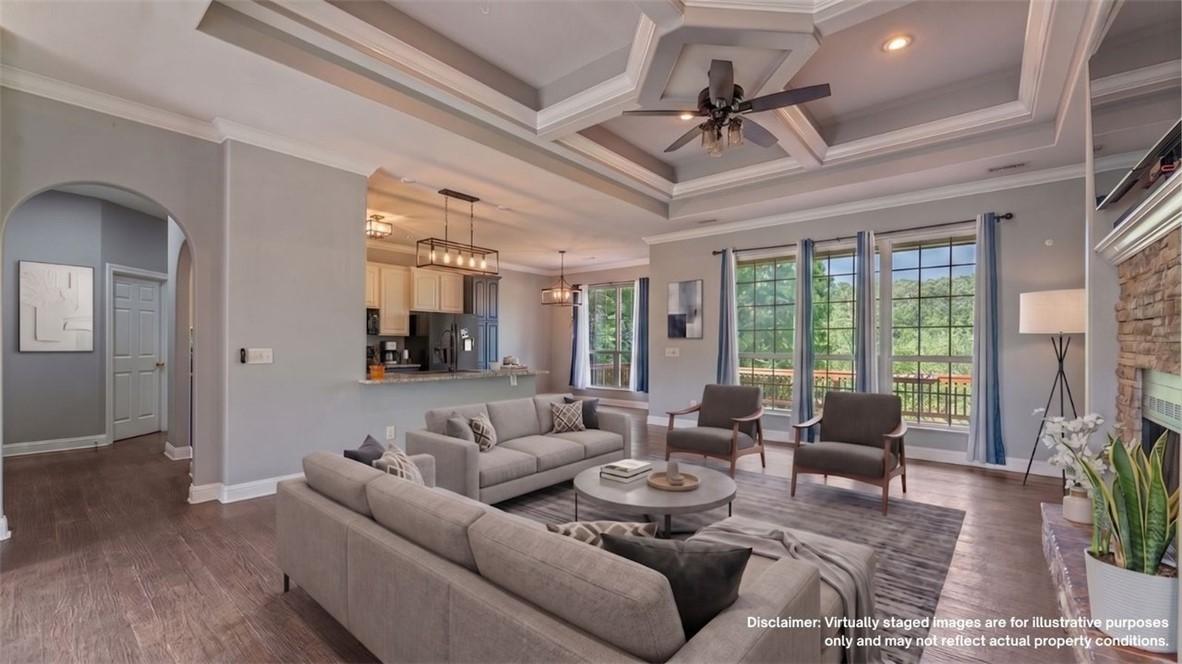 Image 3: Spacious living area featuring a coffered ceiling